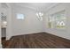 Bright dining area with hardwood floors, a decorative chandelier, and lots of natural light at 3053 Roy Ct, Apex, NC 27523