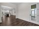 Welcoming entryway showcasing beautiful hardwood floors and views into kitchen area at 3053 Roy Ct, Apex, NC 27523