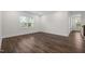 Bright living room with a large window and hardwood flooring at 3053 Roy Ct, Apex, NC 27523