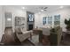 Living room features a fireplace, modern decor, ceiling fan, and natural light at 3053 Roy Ct, Apex, NC 27523