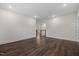 Spacious living room with dark wood floors and neutral wall color at 3053 Roy Ct, Apex, NC 27523
