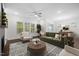 Contemporary living room with natural light, fireplace, and modern decor at 3053 Roy Ct, Apex, NC 27523