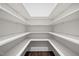 Walk-in pantry features wood floors, white shelving, and plenty of storage space at 3053 Roy Ct, Apex, NC 27523