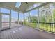 Covered outdoor porch with a screened-in area, skylight and serene wooded views at 3053 Roy Ct, Apex, NC 27523