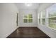 Bright sunroom with large windows offering ample natural light and views of the backyard at 3053 Roy Ct, Apex, NC 27523