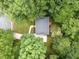 An aerial view of a home featuring a gray roof surrounded by lush greenery at 308 Trappers Sack Rd, Cary, NC 27513