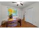 Bedroom featuring hardwood floors, a desk, and a map on the wall, with a doorway leading to other rooms at 308 Trappers Sack Rd, Cary, NC 27513