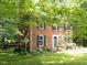 Beautiful two-story brick home with black shutters and a lush green lawn at 308 Trappers Sack Rd, Cary, NC 27513