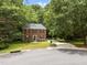 Charming two-story brick home surrounded by mature trees, offering a private and serene setting at 308 Trappers Sack Rd, Cary, NC 27513