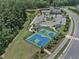 Aerial view of neighborhood amenities including pool, playground, sport court and parking at 3181 Zebroid Way, New Hill, NC 27562