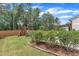 A lush backyard features a playground and a patio for outdoor enjoyment and entertaining at 3181 Zebroid Way, New Hill, NC 27562