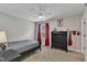 Bedroom features a single bed, a dark dresser, ceiling fan, and carpet at 3181 Zebroid Way, New Hill, NC 27562