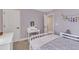 Bedroom featuring a desk, a bed with floral bedding and light purple walls at 3181 Zebroid Way, New Hill, NC 27562