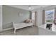 Bedroom featuring a single bed, a window and wallpapered accent wall at 3181 Zebroid Way, New Hill, NC 27562