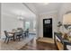 Elegant dining room with a chandelier, a wood table, and stylish decor at 3181 Zebroid Way, New Hill, NC 27562