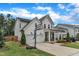 Beautiful home featuring a two-car garage, basketball hoop, and well-maintained lawn at 3181 Zebroid Way, New Hill, NC 27562