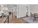 Open-concept living space showcasing hardwood floors and ample natural light at 3181 Zebroid Way, New Hill, NC 27562