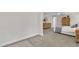 Cozy main bedroom with a dresser and adjoining space to relax at 3181 Zebroid Way, New Hill, NC 27562