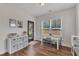 Bright playroom features wood floors, a table set by the window, and backyard access at 3181 Zebroid Way, New Hill, NC 27562