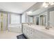 Primary bathroom with large vanity, bathtub, walk-in shower with glass door, and tiled floors at 3304 Buck Run Trl, Wake Forest, NC 27587