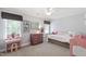 Bright bedroom with carpet, natural light, playful decor, and a ceiling fan at 3304 Buck Run Trl, Wake Forest, NC 27587