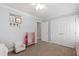 Neutral toned bedroom with carpet, ample closet space, and cozy decor at 3304 Buck Run Trl, Wake Forest, NC 27587