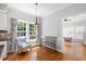 Breakfast nook with light, bright windows, stylish light fixture, and hardwood flooring at 3304 Buck Run Trl, Wake Forest, NC 27587