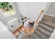 Bright foyer, viewed from above, features hardwood floors, staircase, and front door with side windows at 3304 Buck Run Trl, Wake Forest, NC 27587