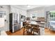 Well-lit kitchen featuring stainless steel appliances, granite countertops, and white cabinets at 3304 Buck Run Trl, Wake Forest, NC 27587