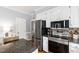 A kitchen featuring stainless steel appliances, granite counters, and white cabinetry at 3304 Buck Run Trl, Wake Forest, NC 27587