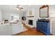 Living room with a fireplace, television, and a view of an outdoor patio at 3304 Buck Run Trl, Wake Forest, NC 27587