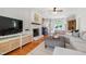 Cozy living room featuring a painted brick fireplace, mantle, and bay window at 3304 Buck Run Trl, Wake Forest, NC 27587