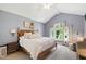 Bright main bedroom with vaulted ceiling, large windows, neutral carpet, and a queen-size bed at 3304 Buck Run Trl, Wake Forest, NC 27587