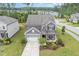 Stunning aerial view of a well-maintained home with a lush lawn, landscaped yard, and inviting curb appeal at 3361 Bordwell Ridge Dr. Dr, New Hill, NC 27562