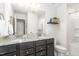 Bathroom featuring dual sinks, granite counters, and a shower-tub combo at 3361 Bordwell Ridge Dr. Dr, New Hill, NC 27562