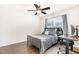 Bedroom featuring a gray bed, wood floors, gray rug and work desk area at 3361 Bordwell Ridge Dr. Dr, New Hill, NC 27562