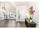 Bright foyer with a large picture window, a modern light fixture, and dark wood floors at 3361 Bordwell Ridge Dr. Dr, New Hill, NC 27562