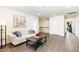Cozy living room featuring a comfortable sofa, stylish decor, and durable hardwood flooring throughout at 3361 Bordwell Ridge Dr. Dr, New Hill, NC 27562