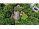Aerial view of the home and wooded lot, surrounded by mature trees at 3600 Trail 23 St, Durham, NC 27707