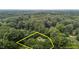 An aerial view showing the tree coverage and seclusion of the property at 3600 Trail 23 St, Durham, NC 27707