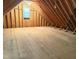 Unfinished attic space with exposed rafters and plywood flooring at 3600 Trail 23 St, Durham, NC 27707