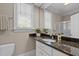 Bathroom with a granite countertop and view of the shower at 3600 Trail 23 St, Durham, NC 27707
