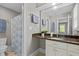 Bathroom features granite countertop, single sink vanity and tiled floors with a shower at 3600 Trail 23 St, Durham, NC 27707