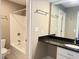 Well-lit bathroom with a granite vanity and a shower-tub combo at 3600 Trail 23 St, Durham, NC 27707