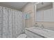 Bathroom featuring granite countertop, white cabinets, and a shower and bathtub combo at 3600 Trail 23 St, Durham, NC 27707