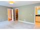 Spacious bedroom featuring neutral walls, plush carpeting, and ample closet space at 3600 Trail 23 St, Durham, NC 27707