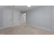 Spacious bedroom with multiple closets and light blue walls at 3600 Trail 23 St, Durham, NC 27707