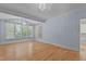 Bedroom with hardwood floors, a chandelier, large windows and ensuite bathroom entrance at 3600 Trail 23 St, Durham, NC 27707