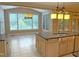 Bright breakfast nook featuring large windows, granite countertops, and a sink with a view to the backyard at 3600 Trail 23 St, Durham, NC 27707
