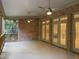 Covered brick porch featuring brick and wood architecture and access to the backyard and interior via french doors at 3600 Trail 23 St, Durham, NC 27707